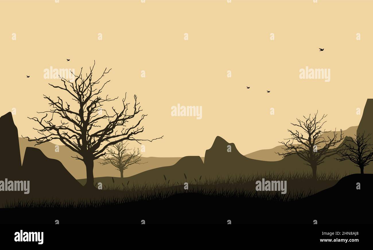 Great mountain view of the city with the silhouette of dry pine trees ...