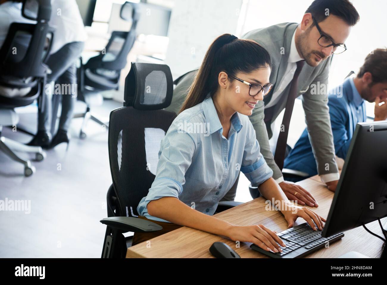 Portrait of successful business team working in office Stock Photo - Alamy