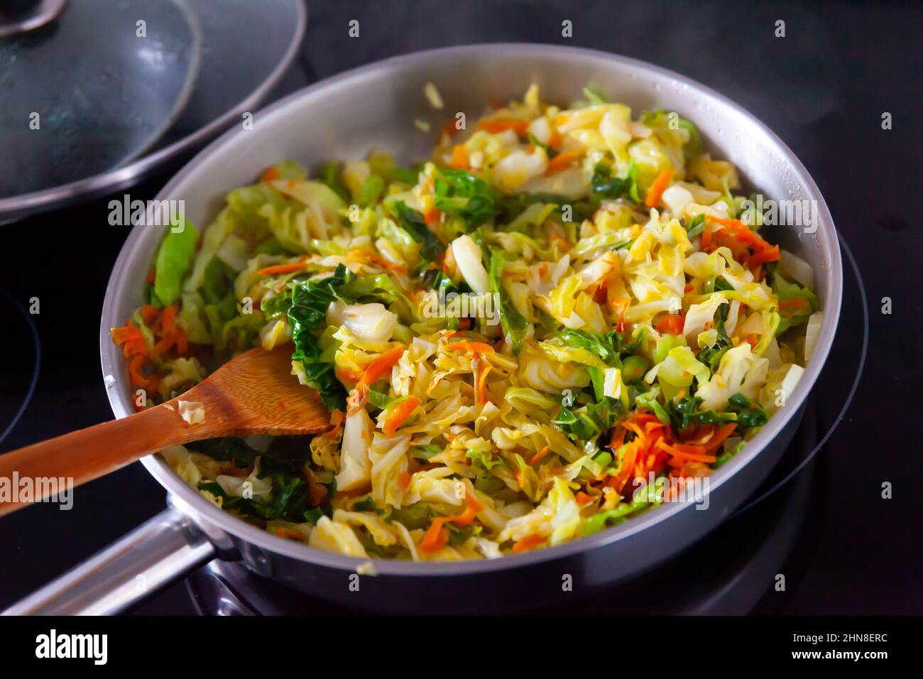 Stewed cabbage in pan on electric stove Stock Photo Alamy