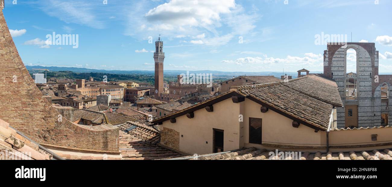 panoramic view of Siena with Torre del Mangia at the Piazza del Campo in Toscana, Italy Stock Photo