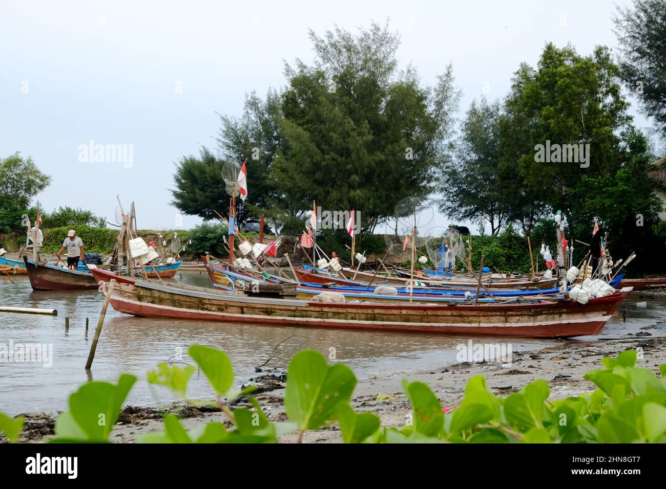 Lampung, Indonesia, February 12 2022- Defocused on Fishing boats on the beach. fishing is the livelihood of local people in Tridarmayoga village, Lamp Stock Photo