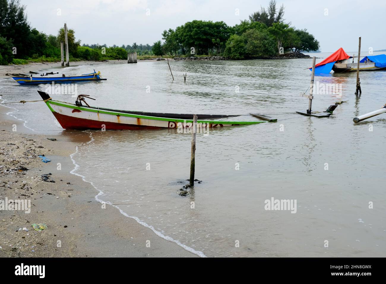 Lampung, Indonesia, February 12 2022- Defocused on Fishing boats on the beach. fishing is the livelihood of local people in Tridarmayoga village, Lamp Stock Photo