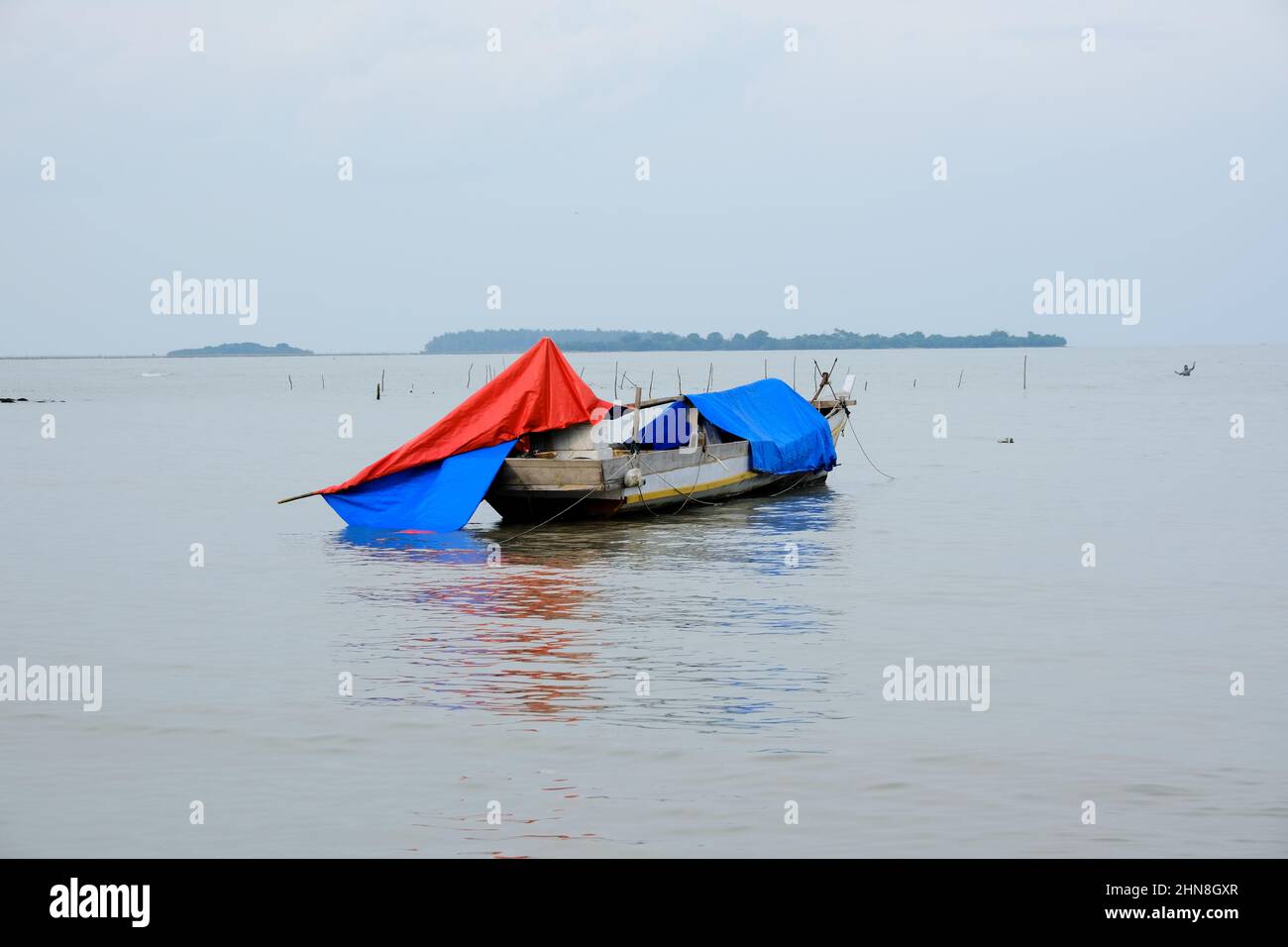 Lampung, Indonesia, February 12 2022- Defocused on Fishing boats on the beach. fishing is the livelihood of local people in Tridarmayoga village, Lamp Stock Photo