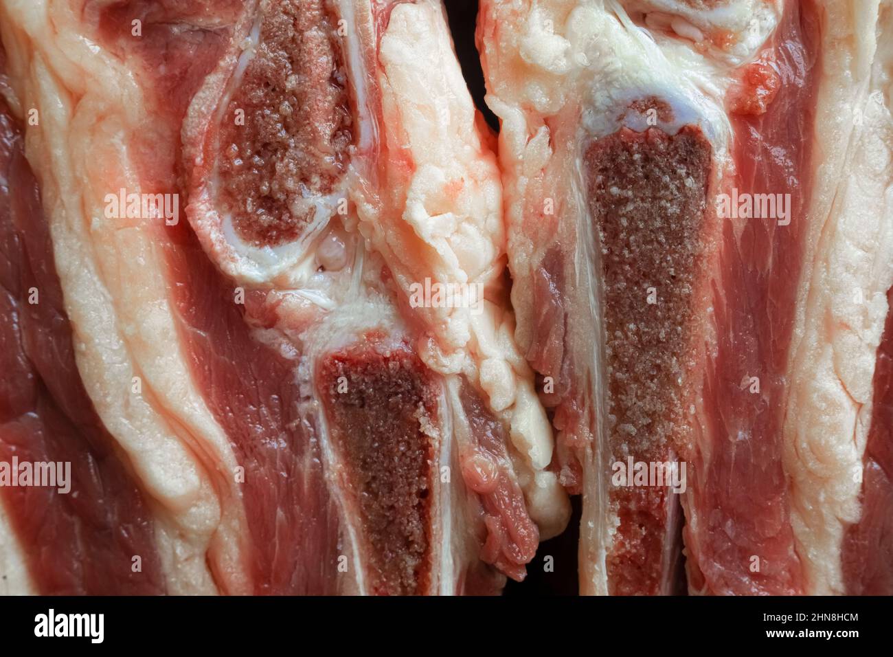 Fat pieces of beef meat with bones and cartilage close-up Stock Photo