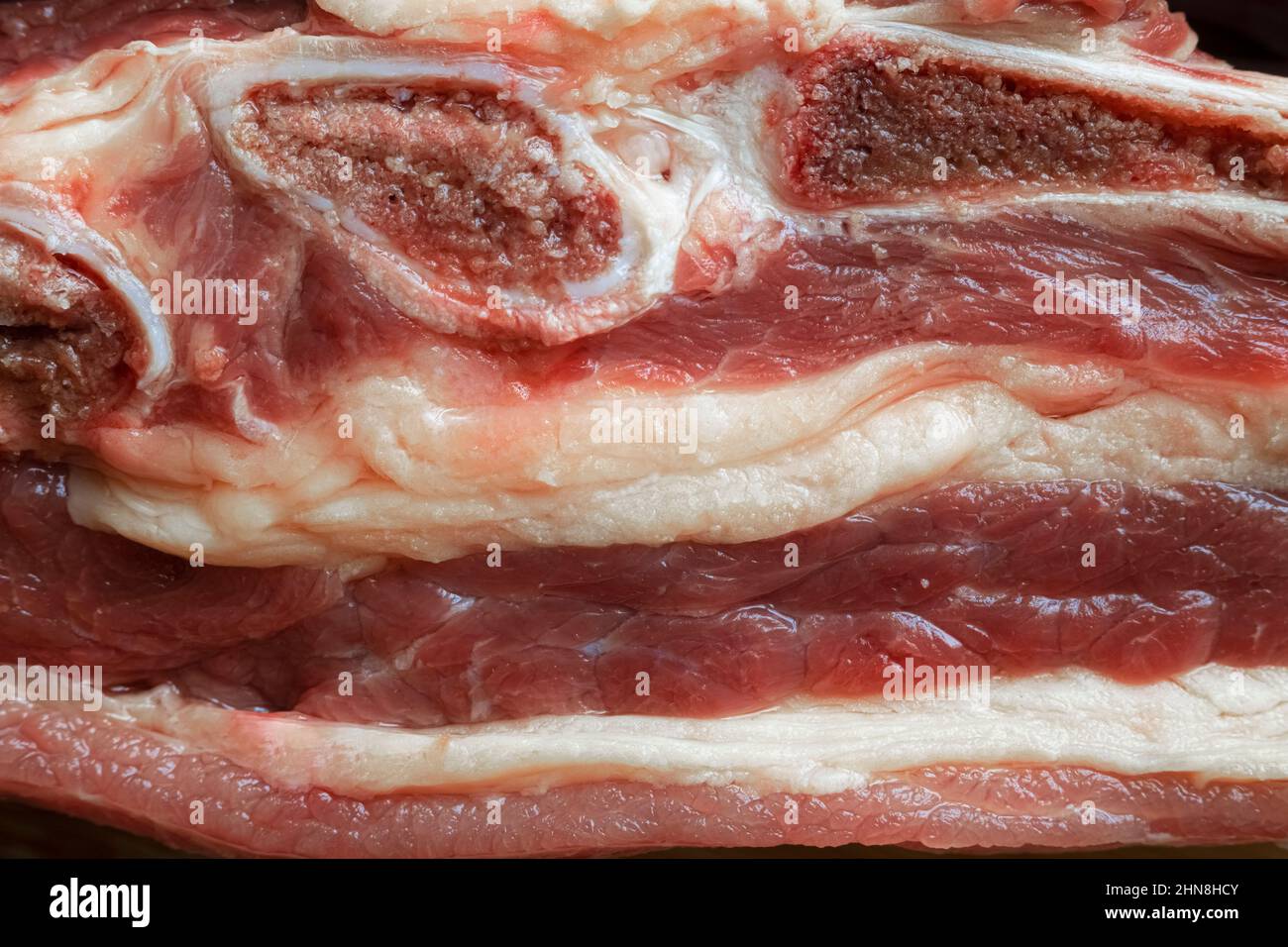 Large piece of beef with bones and fat close-up Stock Photo