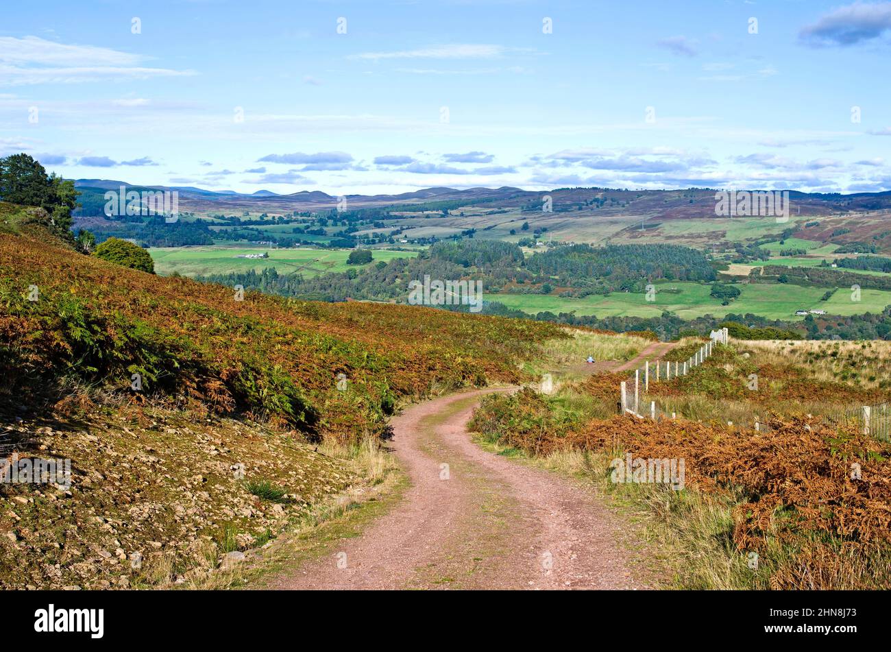 Winding moorland track on hillside above Tay valley, with high level views to hills across the valley, autumn, Tayside, Perthshire Scotland UK Stock Photo