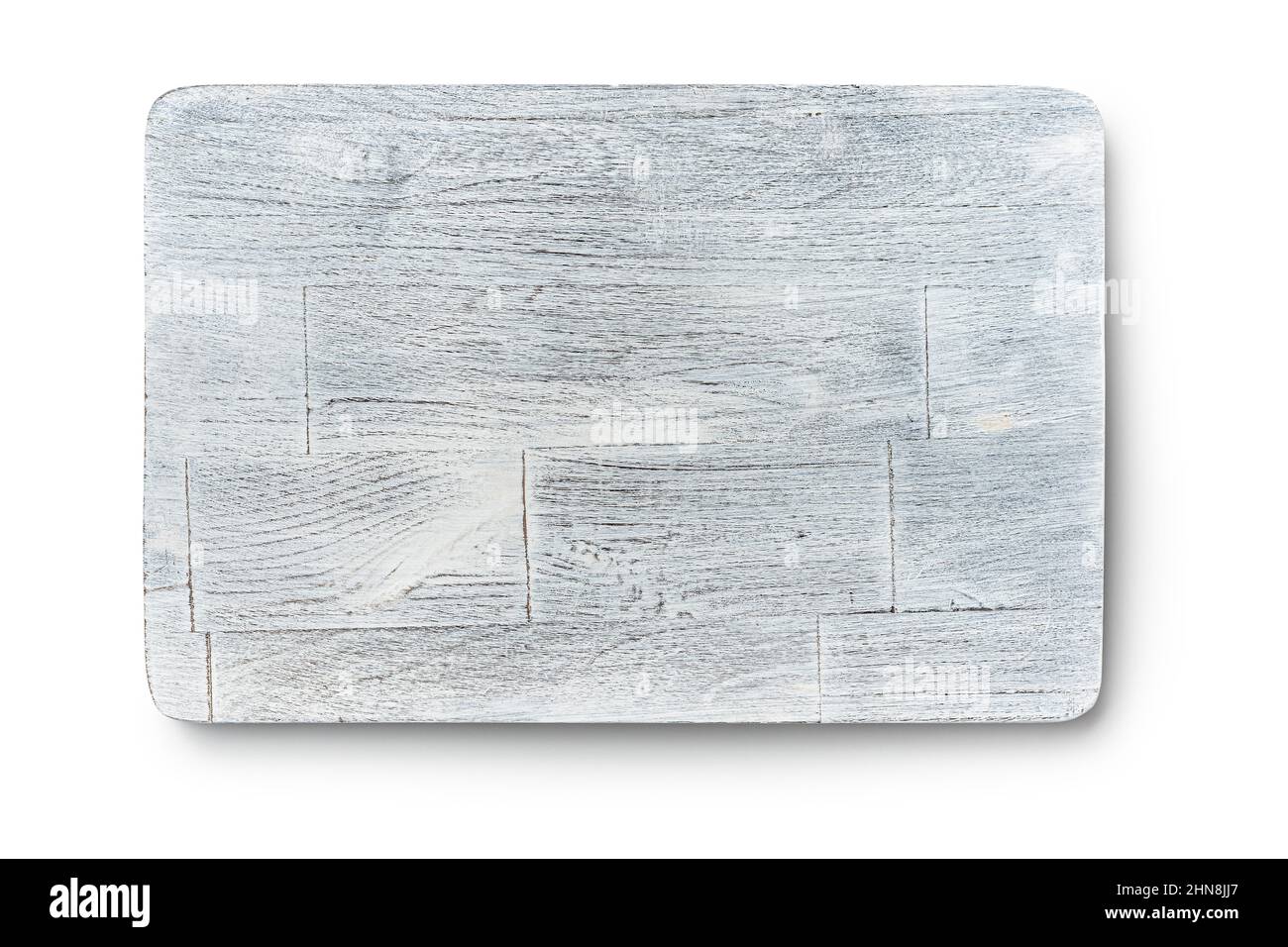 Rustic chopping board. Old white cutting board isolated on a white background. Stock Photo