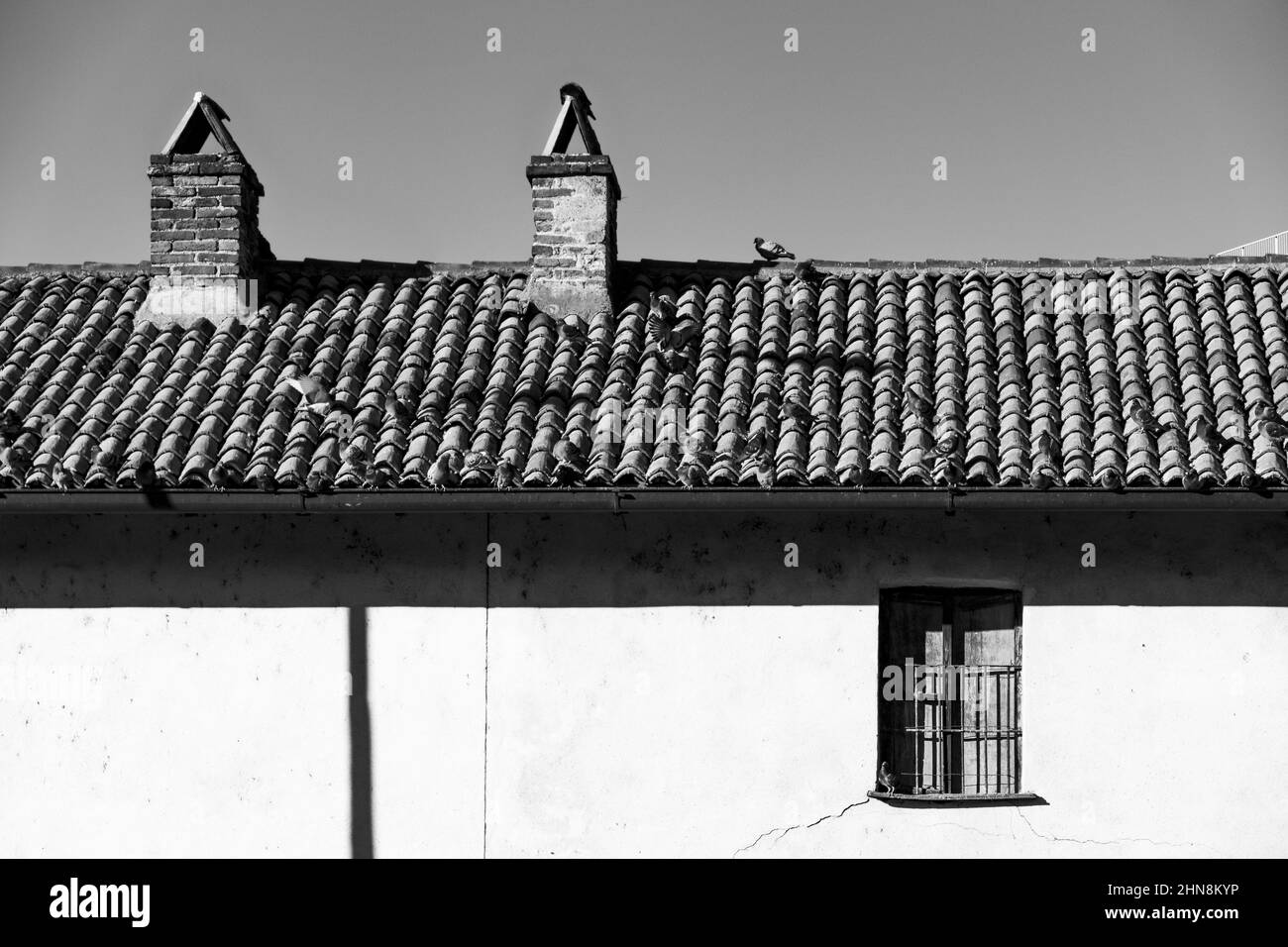 Grayscale shot of the old building roof tiles against the sky Stock ...
