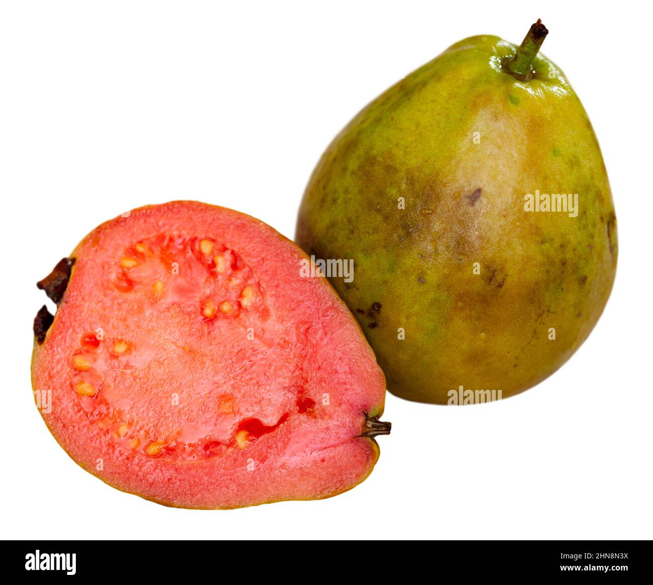Red Guvas Fresh organic red guavas fruit cut in half on a wooden board. Exotic ...