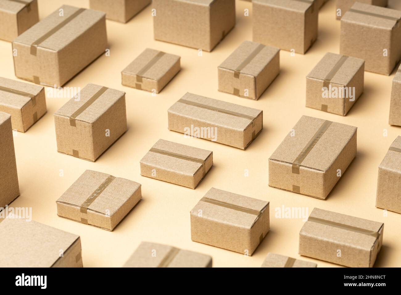 Lots of cardboard boxes pattern on brown background Stock Photo - Alamy