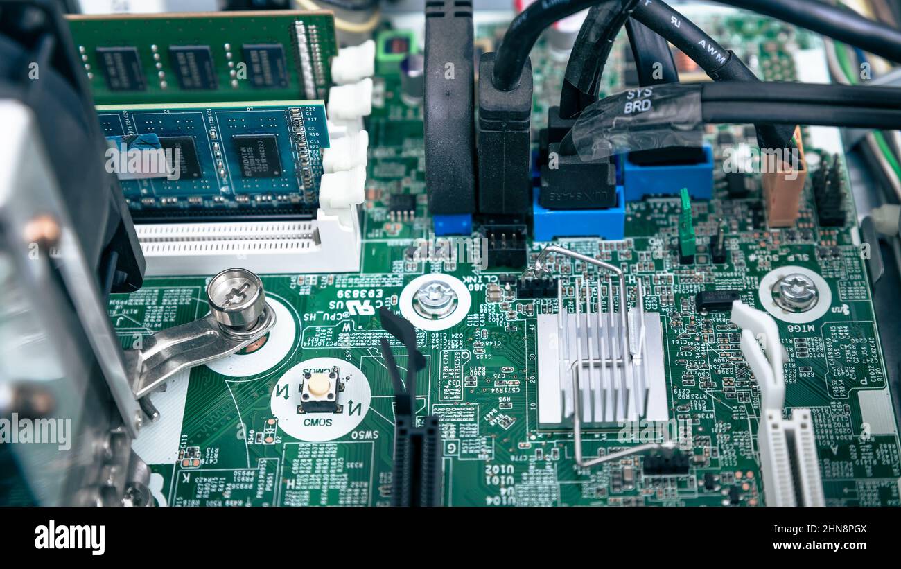 Woodville, Australia - October 15, 2021: Close-up top view of motherboard RAM and cables in business desktop PC Stock Photo