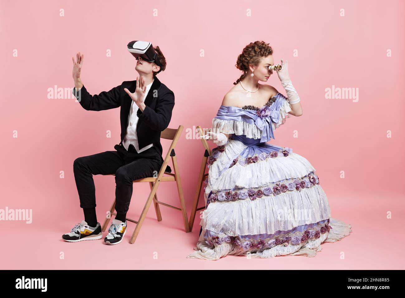 Two people young beautiful woman in image of medieval royal person in