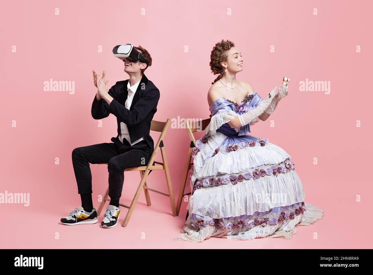 Two people young beautiful woman in image of medieval royal person in