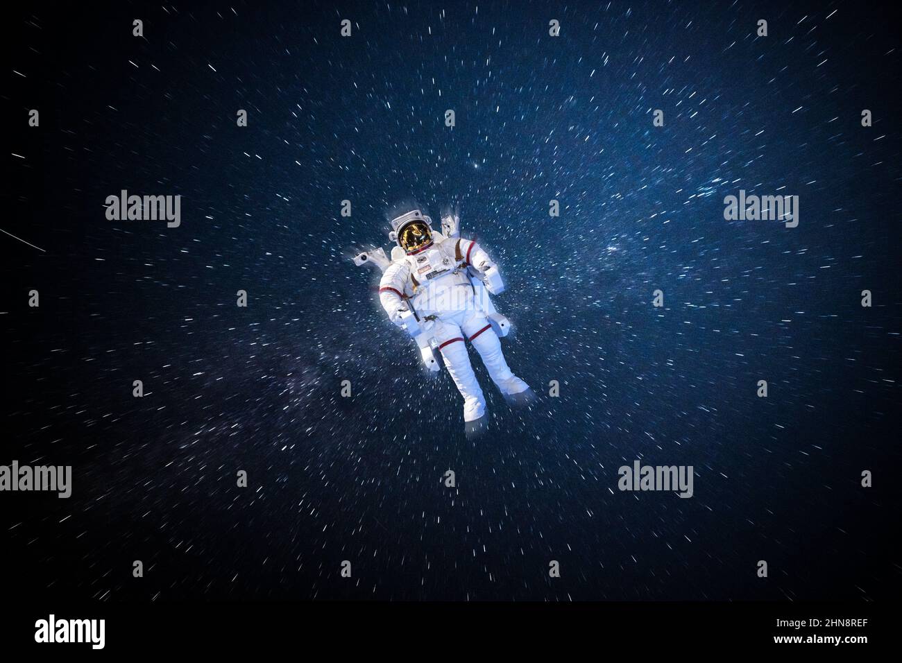 Astronaut spaceman in outer space in full spacesuit on stars and Milky Way background. Elements of this image furnished by NASA space astronaut photos Stock Photo