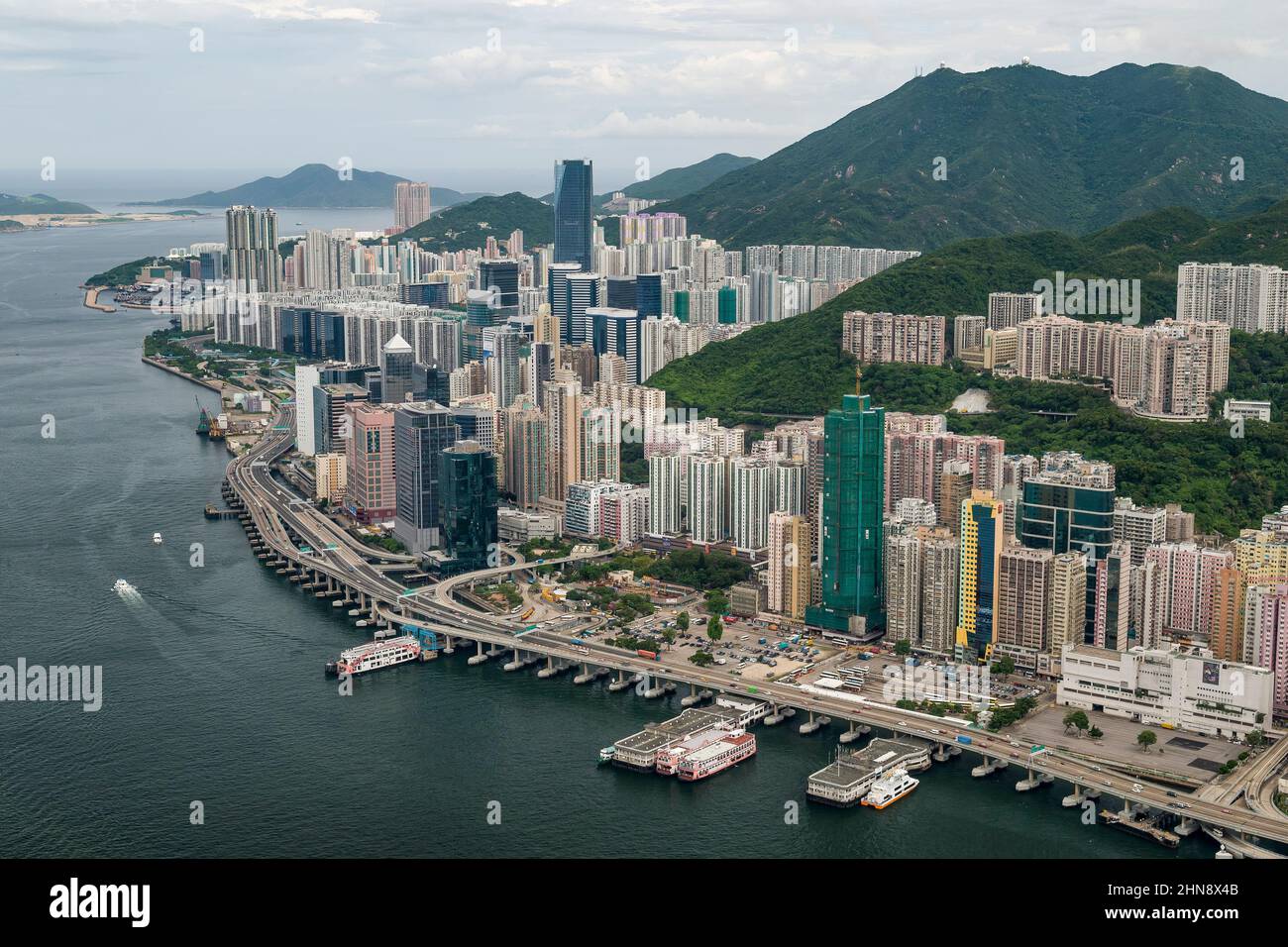 Aerial from helicopter of North Point, Quarry Bay and Taikoo Shing, Hong Kong Island, showing eastern entrance to Victoria Harbour Stock Photo