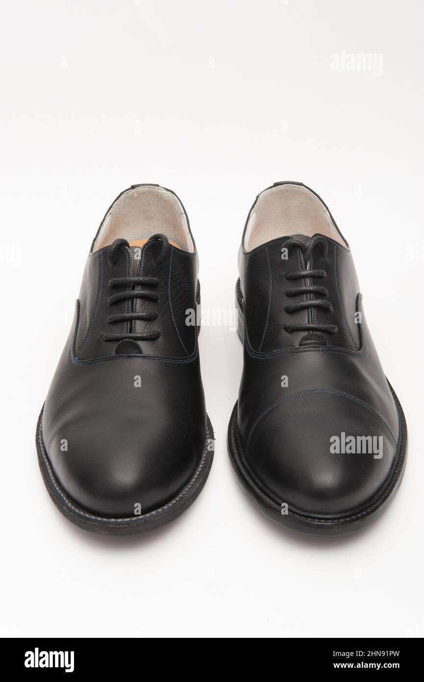 Black men's shoes on a white background Stock Photo - Alamy