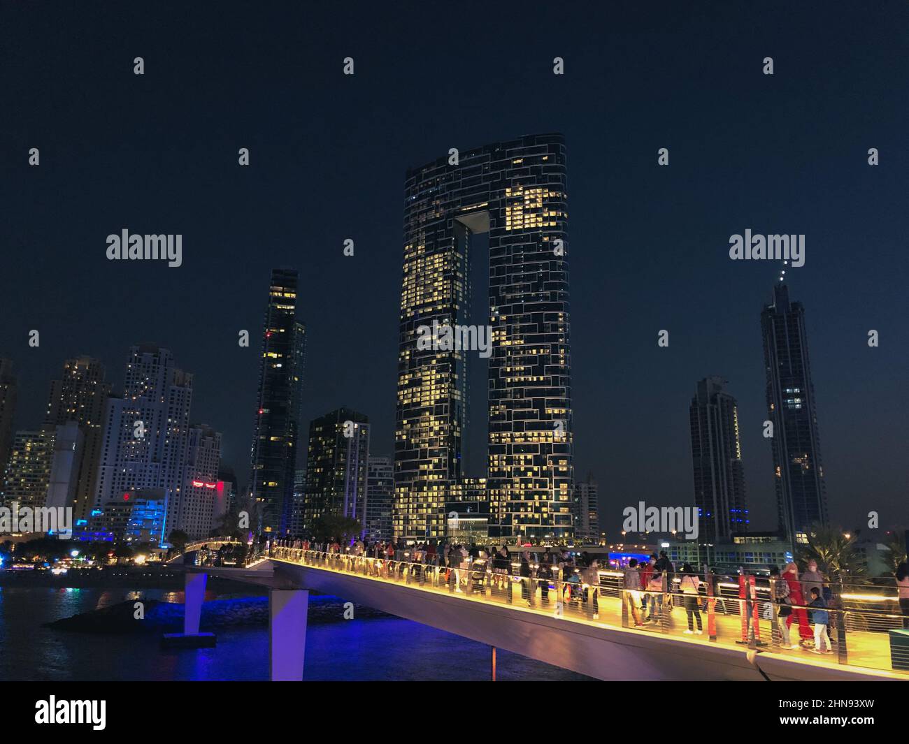 Dubai, United Arab Emirates - 2nd January, 2021 : Visitors to the man-made island called the Bluewaters island taking in the beautiful night views of Stock Photo