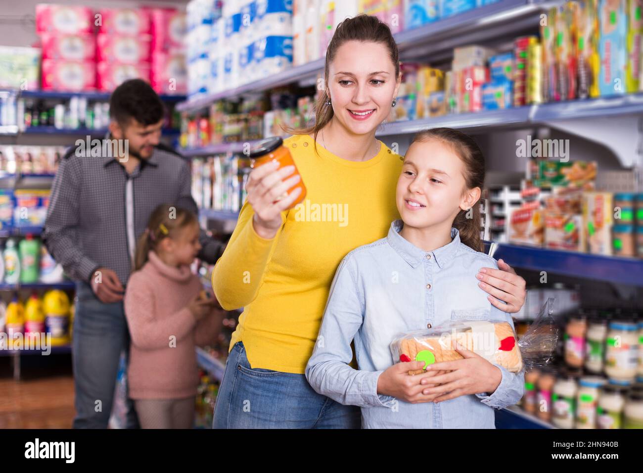 family shopping together in grocery store Stock Photo Alamy