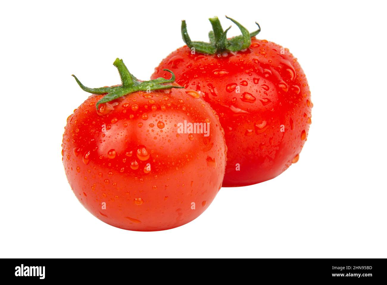 Fresh red tomatoes with wet drops isolated on the white background ...