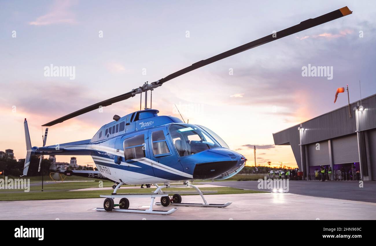 Johannesburg, South Africa, 9th February - 2022: Helicopter waiting on helipad. Stock Photo