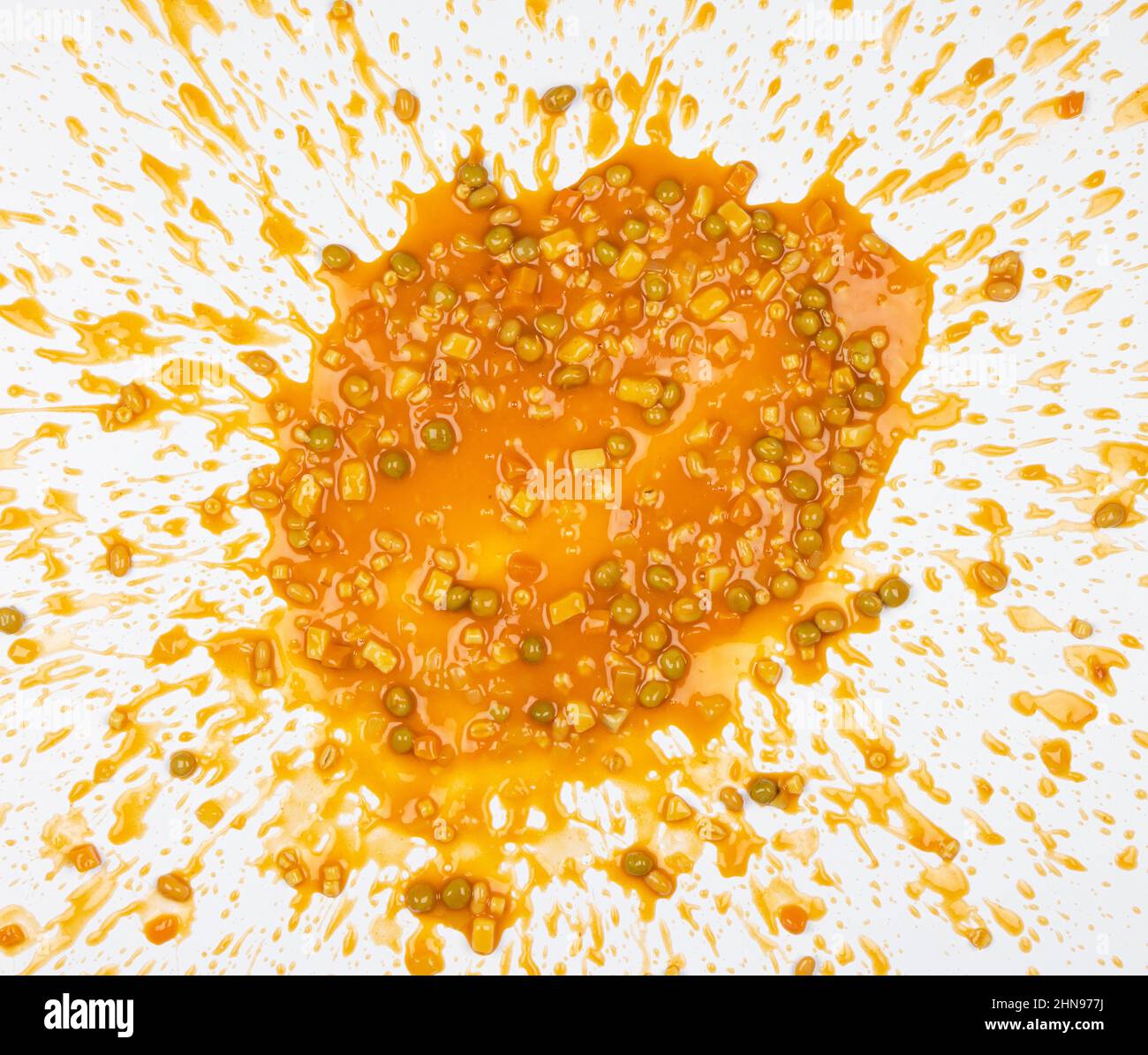 Vegetable soup splattered in a mess that looks like vomit, isolated on a white background Stock Photo