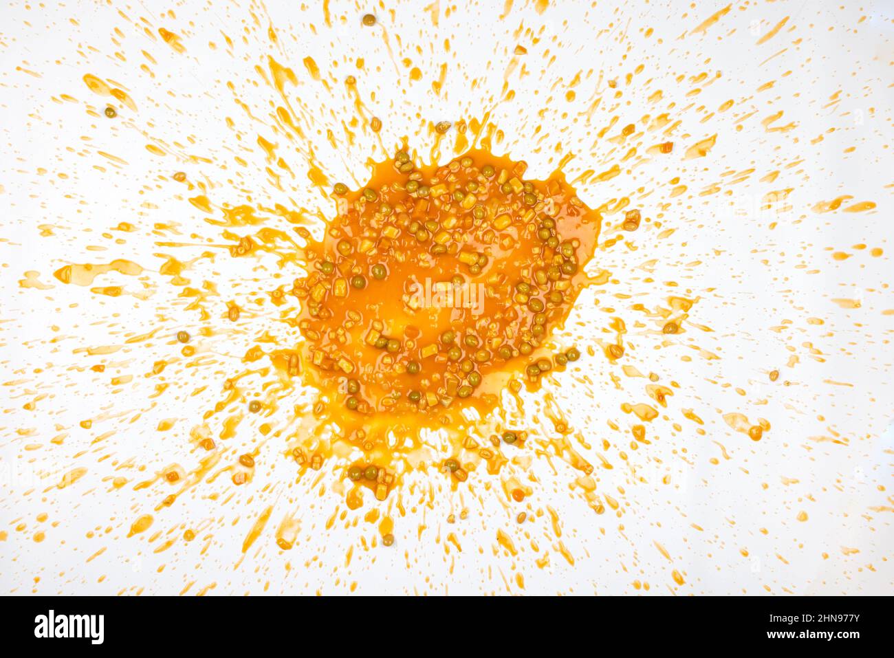 Vegetable soup splattered in a mess that looks like vomit, isolated on a white background Stock Photo