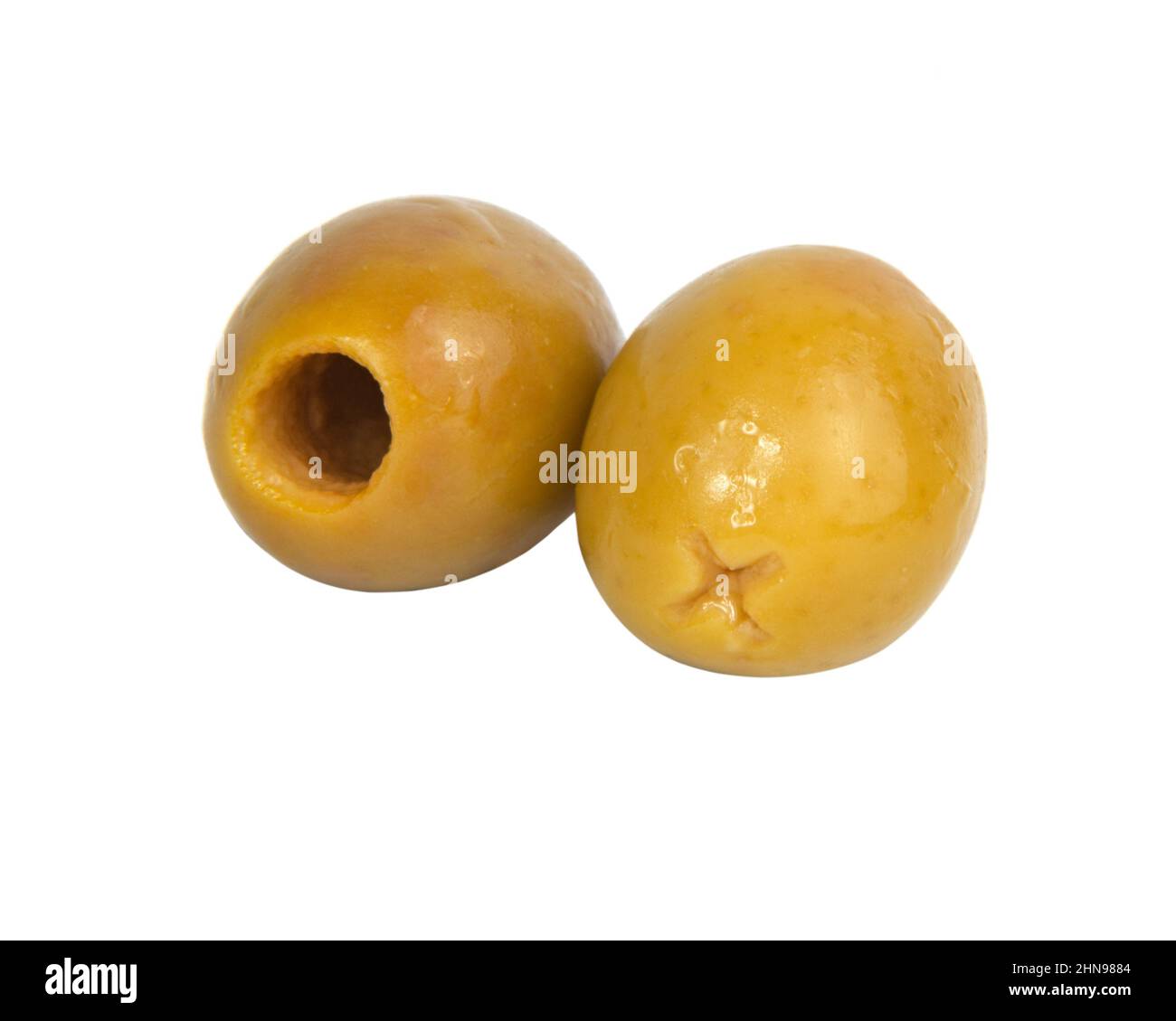 Two green olives pitted isolated on the white background Stock Photo