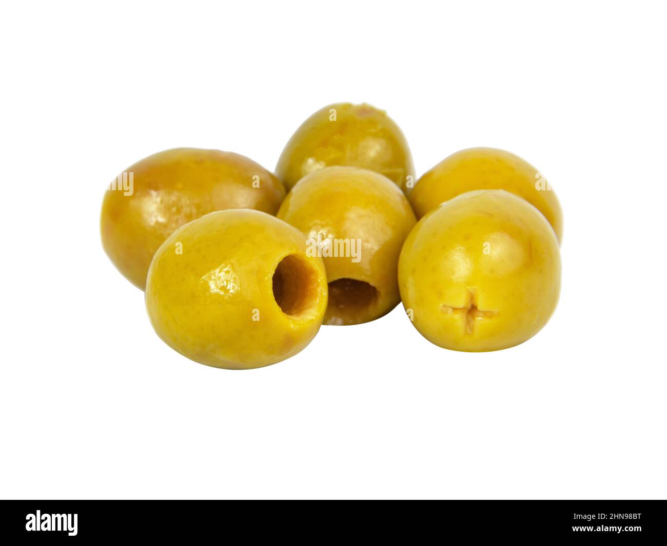 Many green olives pitted isolated on the white background Stock Photo