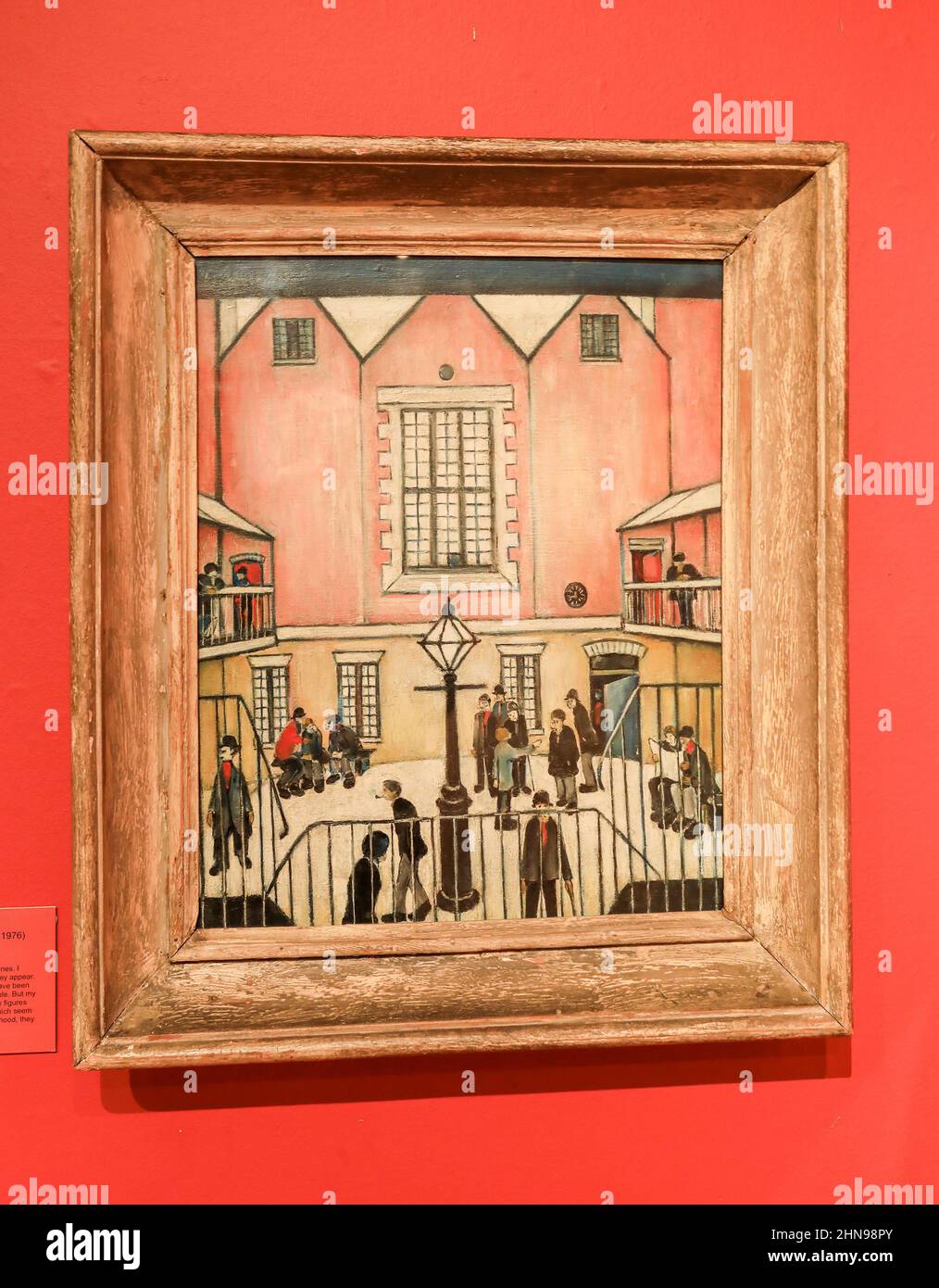 A picture called 'The Courtyard' by L. S. Lowry at the Potteries Museum and Art Gallery, Hanley, Stoke-on-Trent, Staffs, England, UK Stock Photo