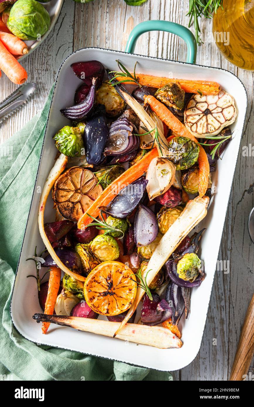 Mixed root vegetable roast with herbs. Healthy simple grill food Stock
