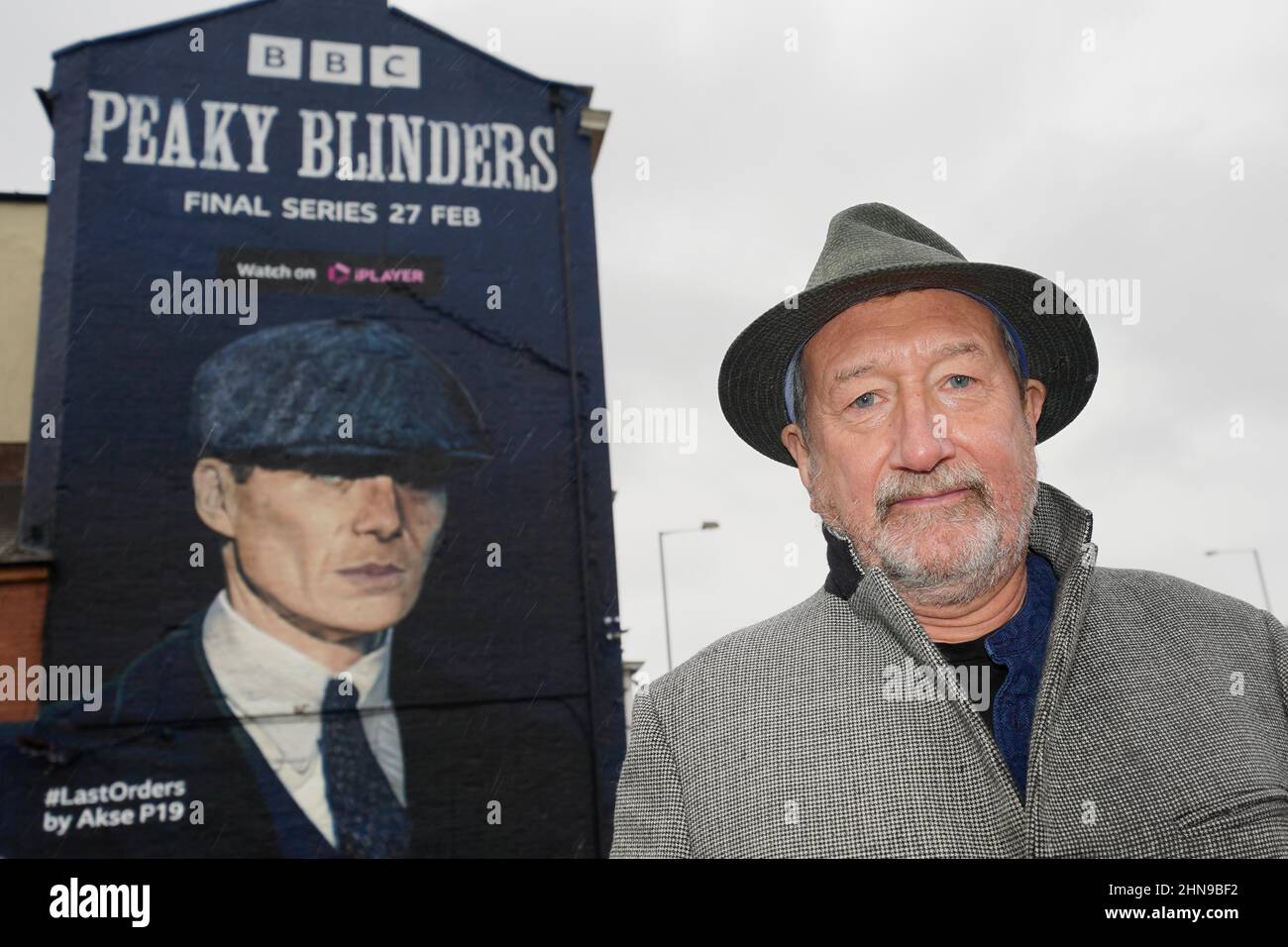 Peaky Blinders creator Steven Knight at the unveiling of a mural by artist Akse P19, of actor Cillian Murphy, as Peaky Blinders crime boss Tommy Shelby, in the historic Deritend area of Birmingham, ahead of the sixth and final series of the hit BBC One crime series. Picture date: Tuesday February 15, 2022. Stock Photo