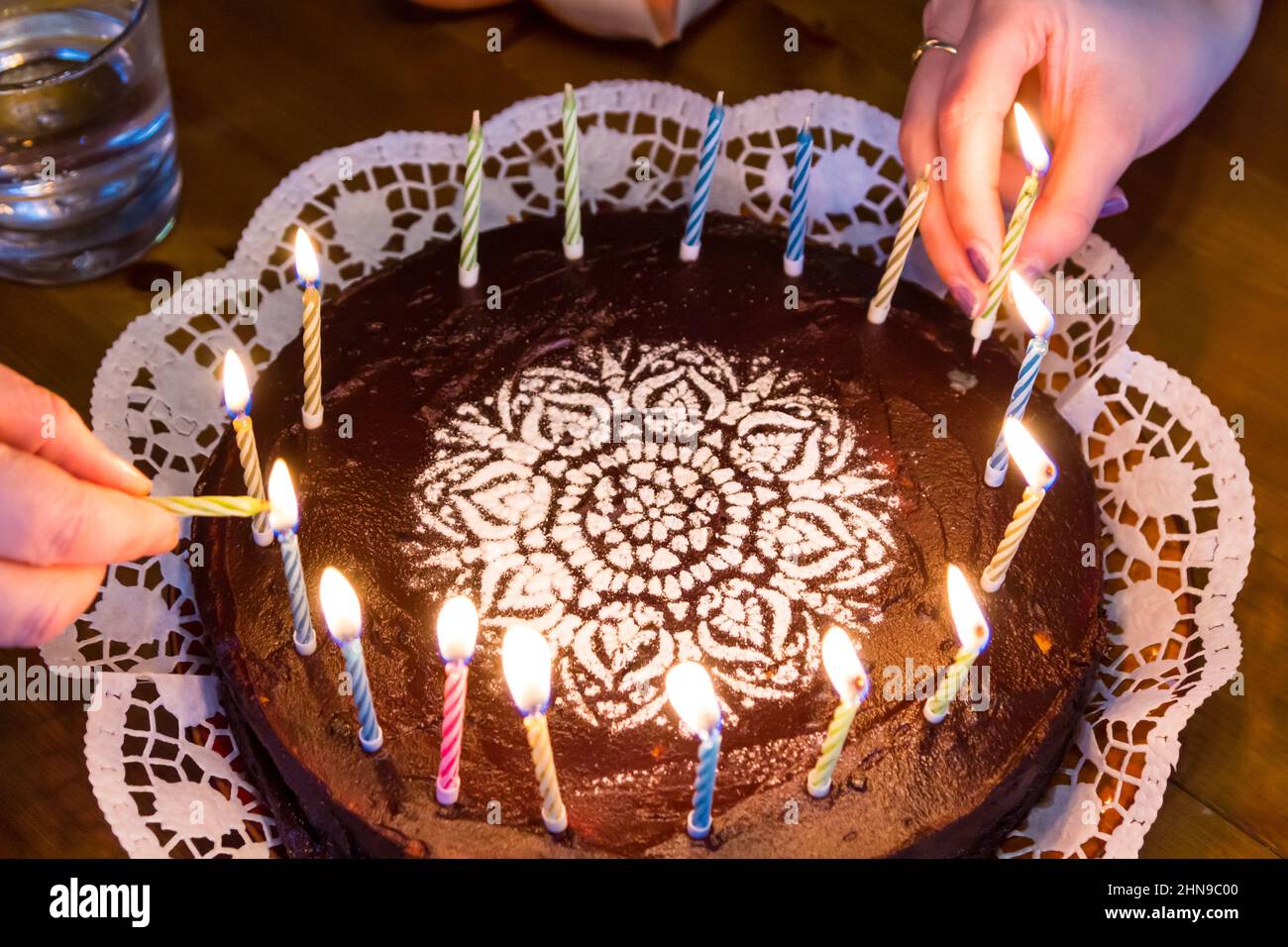 Lighting trick birthday candles on chocolate cake with sugar substitute