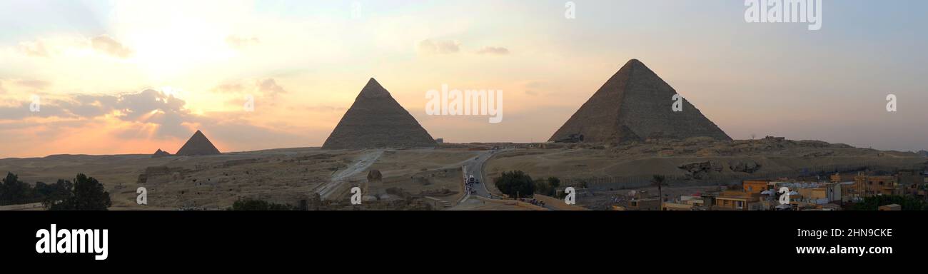 Archaeological complex of the Great Egyptian Pyramids is located on the Giza plateau. second pyramid of Chephren khefren in the night light at sunset. Stock Photo