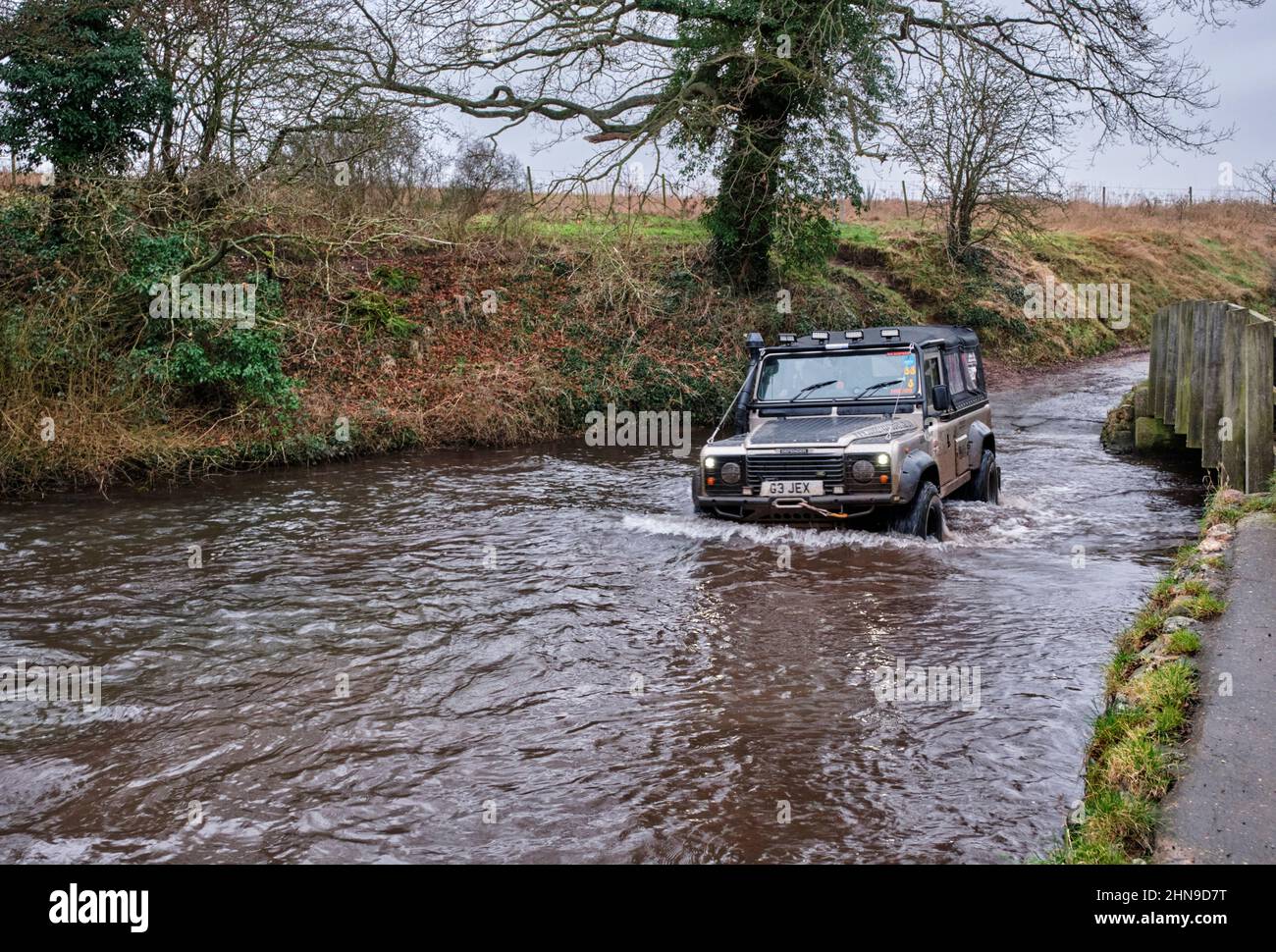 Land Rover fording the River Nar at Castle Acre. Norfolk, England. Stock Photo