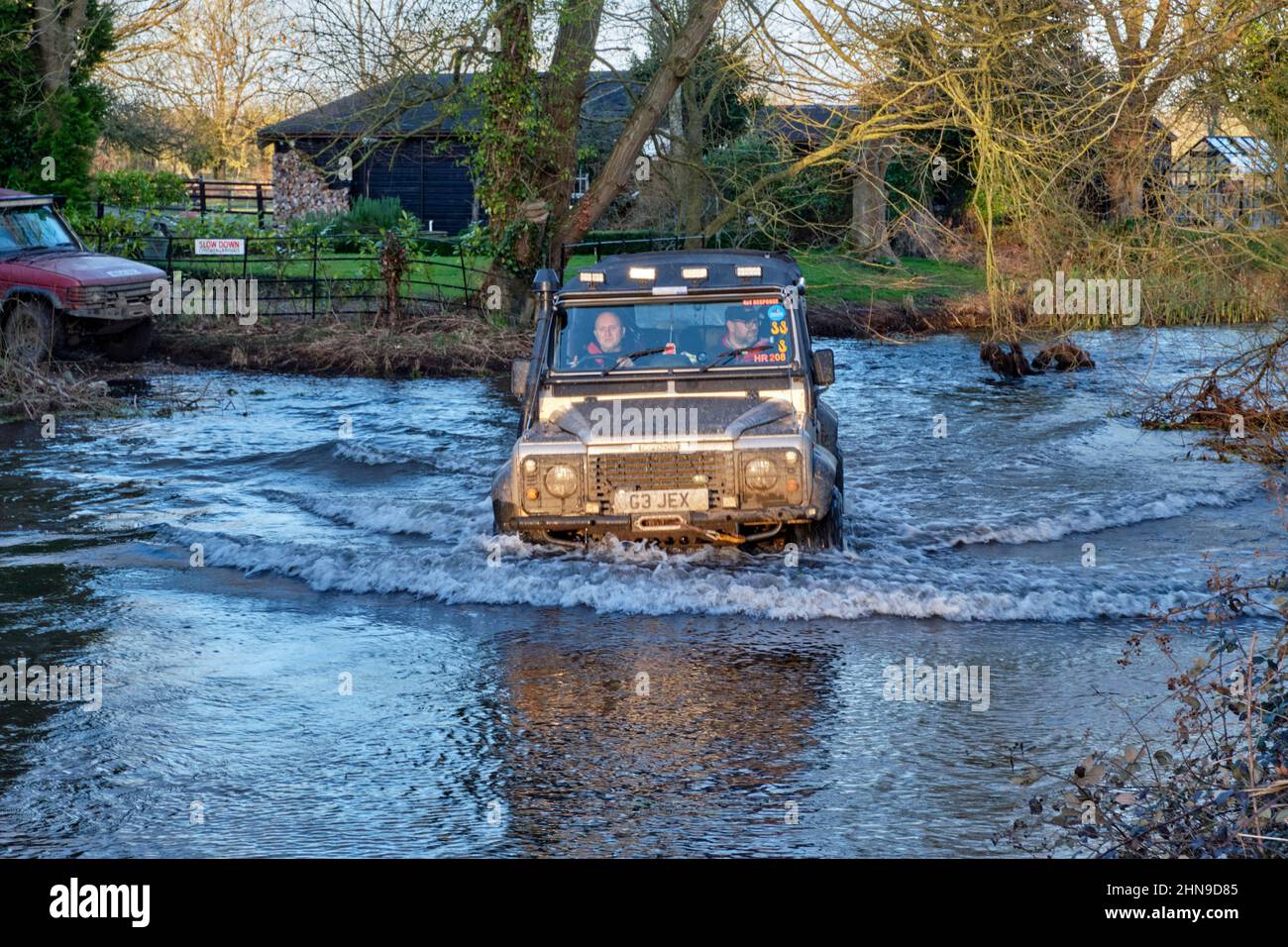 Land Rover fording the River Wensum at Shereford. Norfolk, England. Stock Photo