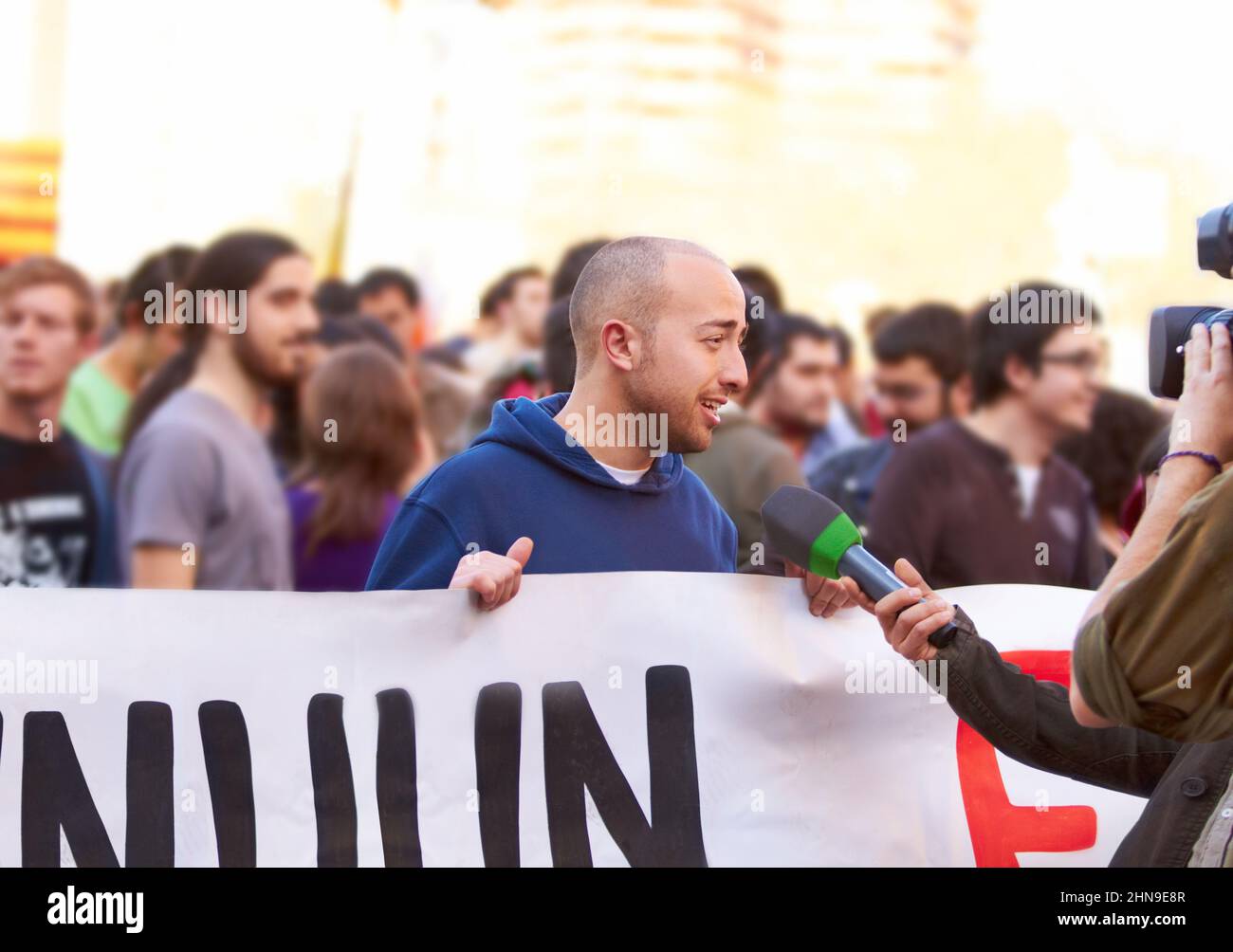 We need to be heard. Shot of a protestor being interviewed at a rally. Stock Photo