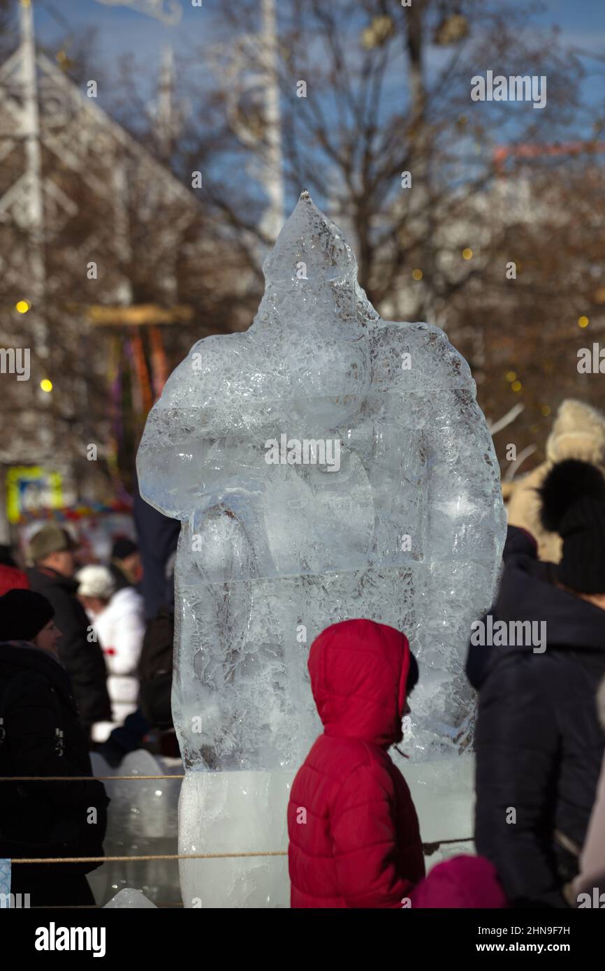 Sculpture of a hero and the royal throne made of ice. Russia. Spring. Stock Photo