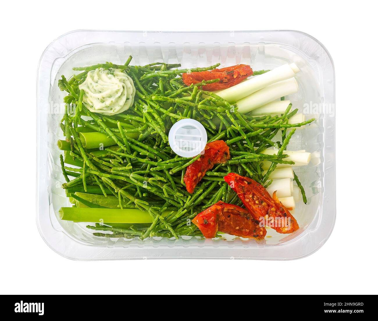 samphire and spring onion with sun-dried tomato in a steam tray, isolated on white Stock Photo