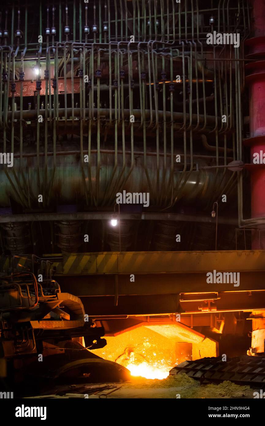 Metallurgy plant (smelter). Arc furnace with liquid hot metal down ...