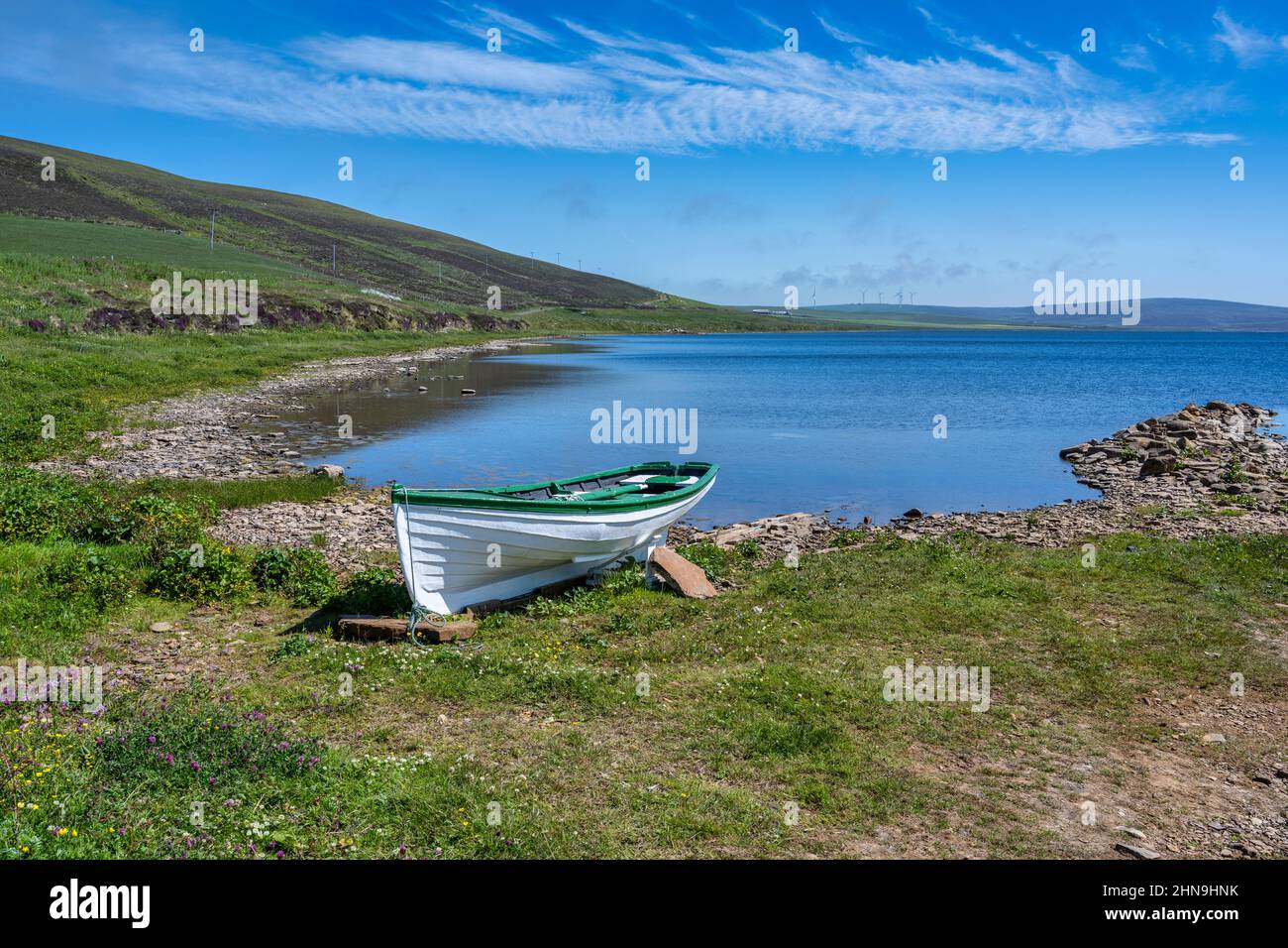 Beached fishing boat on shore of Loch of Swannay on Mainland Orkney in Scotland, UK Stock Photo