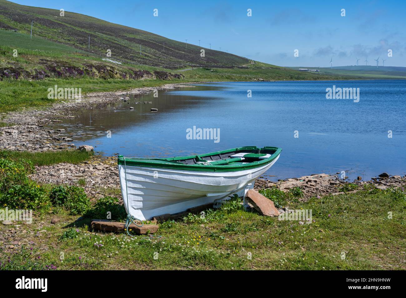Beached fishing boat on shore of Loch of Swannay on Mainland Orkney in Scotland, UK Stock Photo