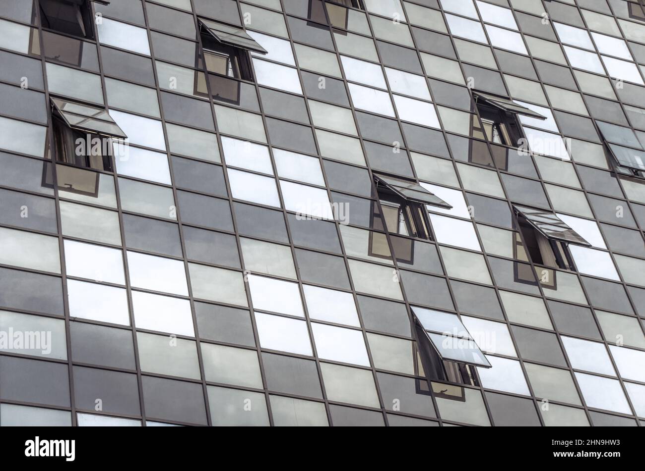 Glass building with open windows Stock Photo