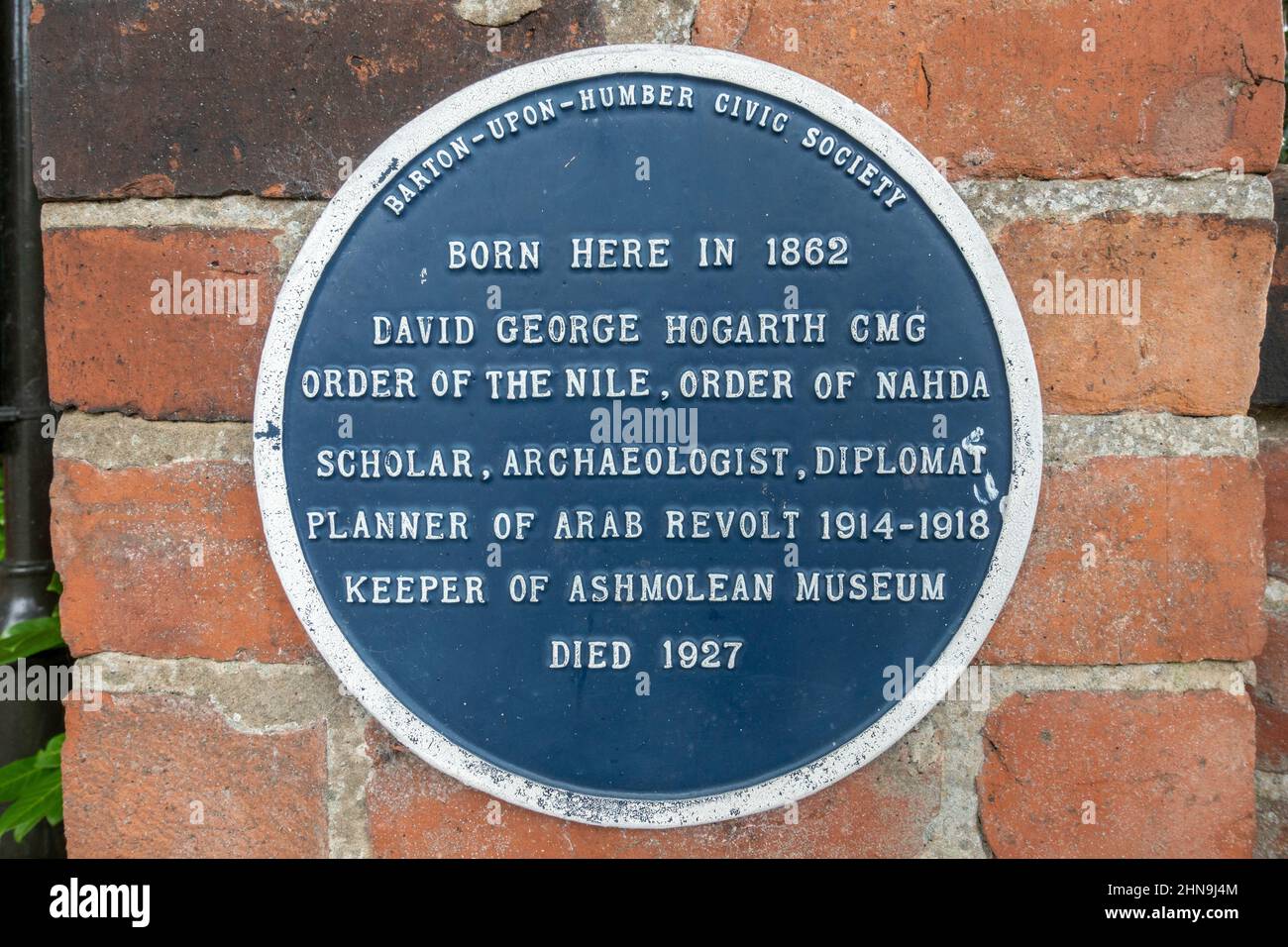 Blue plaque marking birthplace of David George Hogarth CMG, close to St Peter's Church, Barton-upon-Humber, North Lincolnshire, UK. Stock Photo