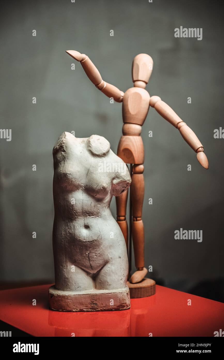 miniature replicate of the Venus statue and wooden human figure Stock Photo