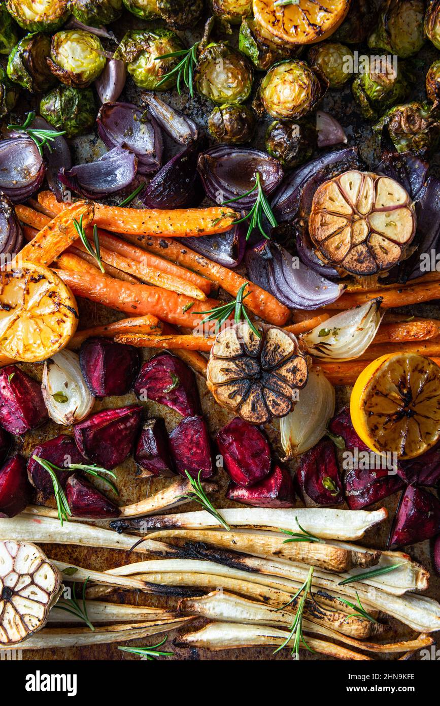 Mixed root vegetable roast with herbs. Healthy simple grill food Stock