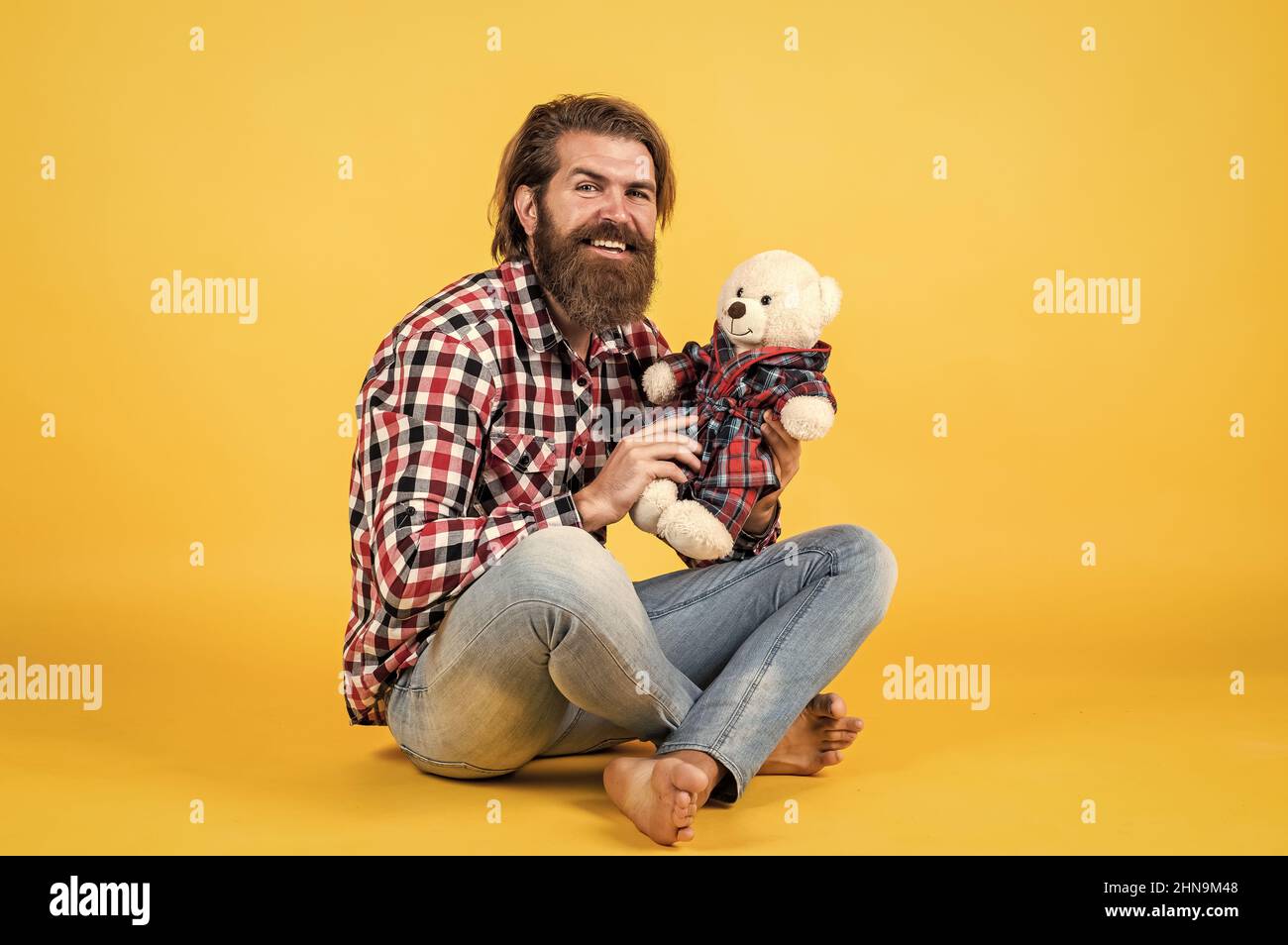 Gifts and holidays concept. This is for you. hipster like animal toy. Birthday holiday party celebration. feel happiness. Man with beard hold cute toy Stock Photo