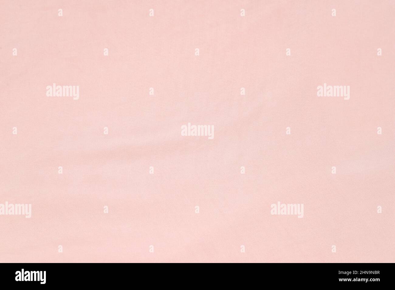 Soft smooth pink silk fabric background. Fabric texture. Stock Photo