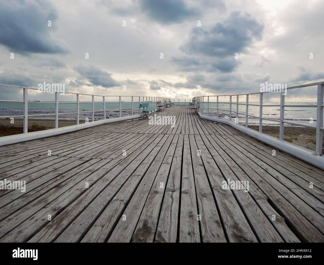Old wooden pier on the shore of the Caspian Sea. 24 January 2020 year. Stock Photo