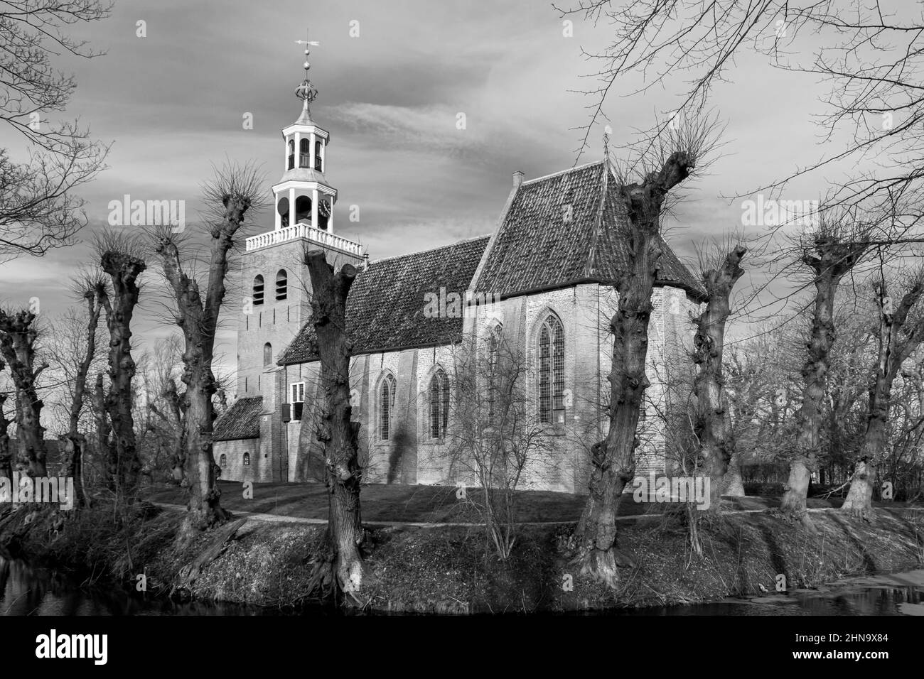 The Petrus church photographed in black and white, in the village of Pieterburen, known from the walking path called 'Pieterpad' that runs all the way Stock Photo