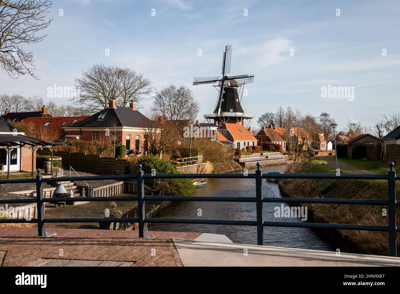 The old mill with the name 'Dutch prosperity' right next to the famous hiking trail with the name 'Pieterpad' in the beautiful village of Mensingeweer Stock Photo